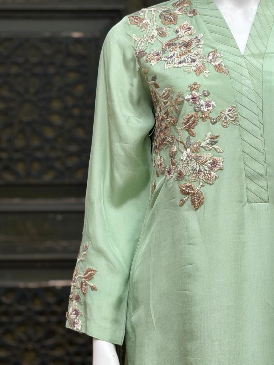 Detailed floral embroidery on a premium suit